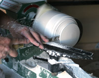 Lathe turning a lid for a new urn.